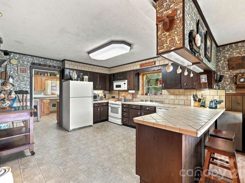 518 Nicholson Cove Road, Cullowhee, NC 28723.  MLS# CAR4411819, YatesRealty ID 43058. 
