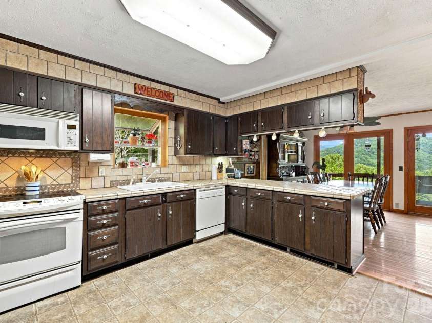 518 Nicholson Cove Road, Cullowhee, NC 28723.  MLS# CAR4411819, YatesRealty ID 43058. 