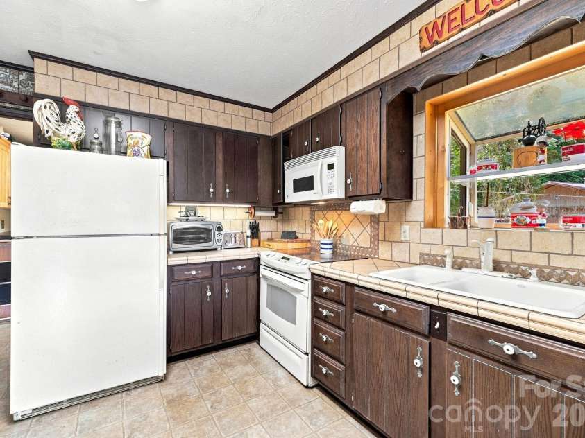518 Nicholson Cove Road, Cullowhee, NC 28723.  MLS# CAR4411819, YatesRealty ID 43058. 
