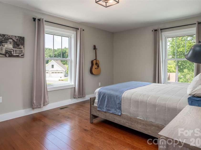 11 Ibbie Roberts Road, Alexander, NC 28701.  MLS# CAR4396356, YatesRealty ID 43060. Main Level guest room