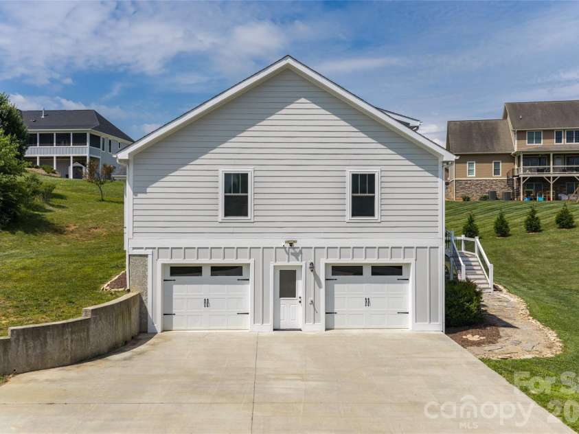 11 Ibbie Roberts Road, Alexander, NC 28701.  MLS# CAR4396356, YatesRealty ID 43060. Two car garage with large driveway
