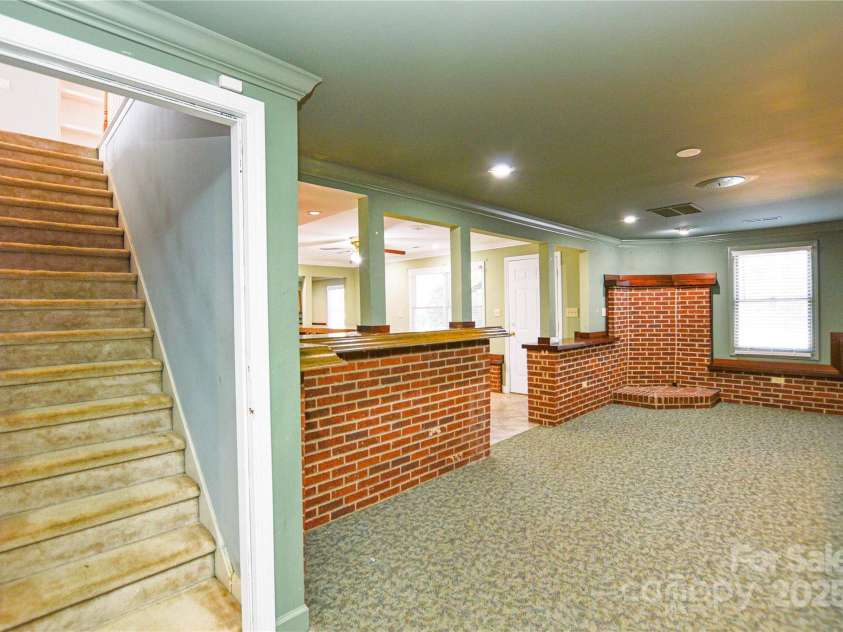 5839 Painted Fern Court, Charlotte, NC 28269.  MLS# CAR4204621, YatesRealty ID 4307. Walk down to Walk-Out Basement