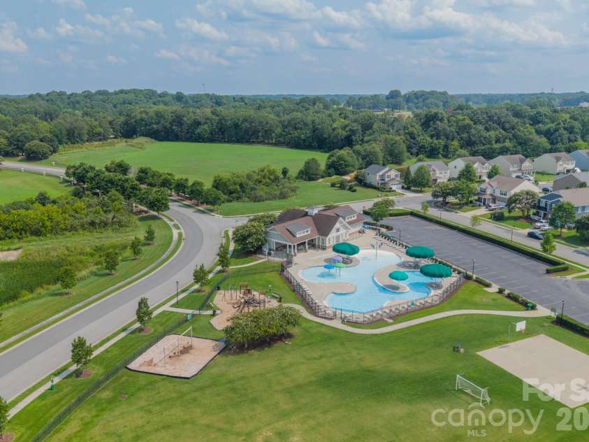 10003 Blue Stream Lane, Indian Trail, NC 28079.  MLS# CAR4408302, YatesRealty ID 43078. Community pool, playground, and game fields.