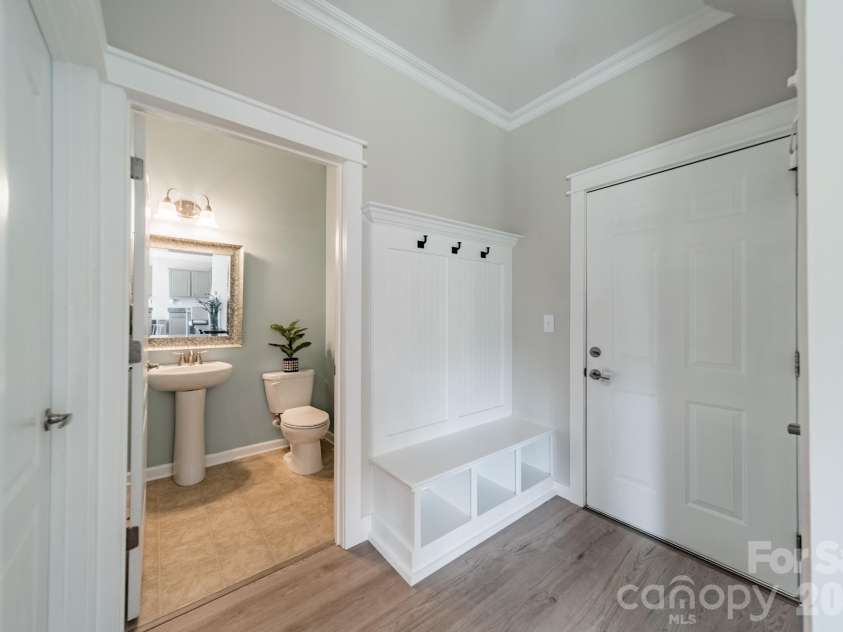 10003 Blue Stream Lane, Indian Trail, NC 28079.  MLS# CAR4408302, YatesRealty ID 43078. Drop zone into heated & cooled side-load garage and main level half bath