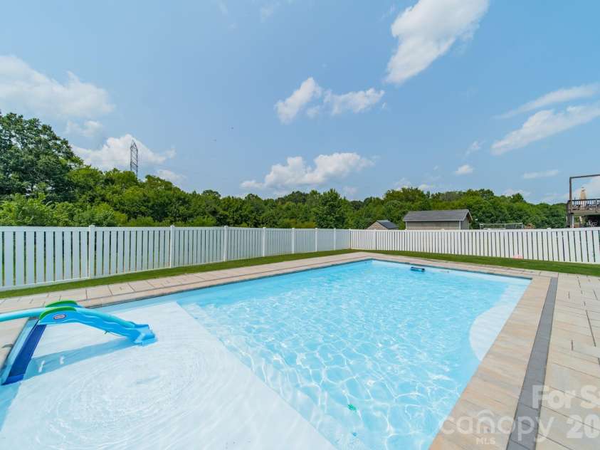 10003 Blue Stream Lane, Indian Trail, NC 28079.  MLS# CAR4408302, YatesRealty ID 43078. In-ground heated saltwater pool