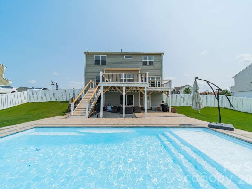 10003 Blue Stream Lane, Indian Trail, NC 28079.  MLS# CAR4408302, YatesRealty ID 43078. In-ground pool and back deck & patio
