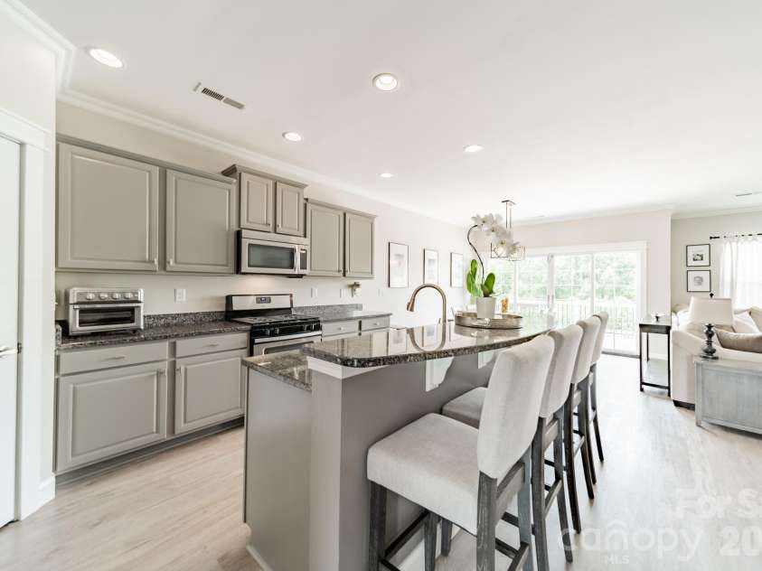 10003 Blue Stream Lane, Indian Trail, NC 28079.  MLS# CAR4408302, YatesRealty ID 43078. Kitchen into dining and living room