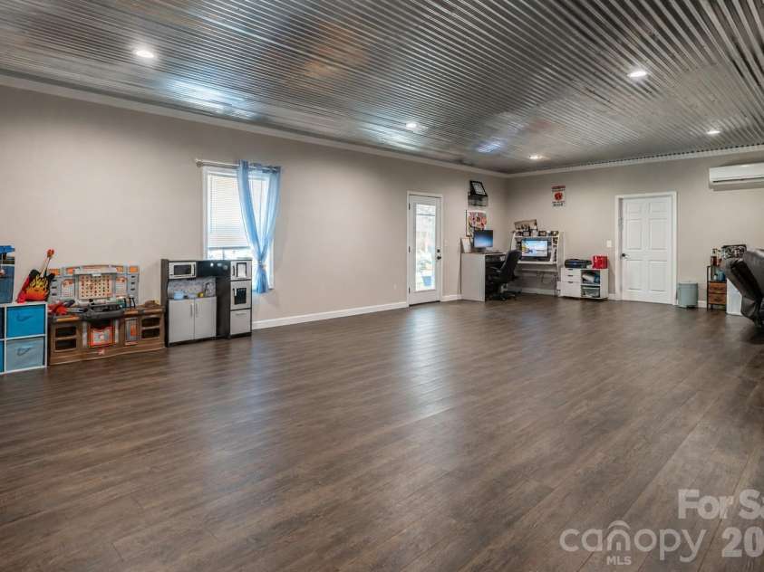 4398 Belmont Drive, Morganton, NC 28655.  MLS# CAR4402124, YatesRealty ID 43080. Basement rec room