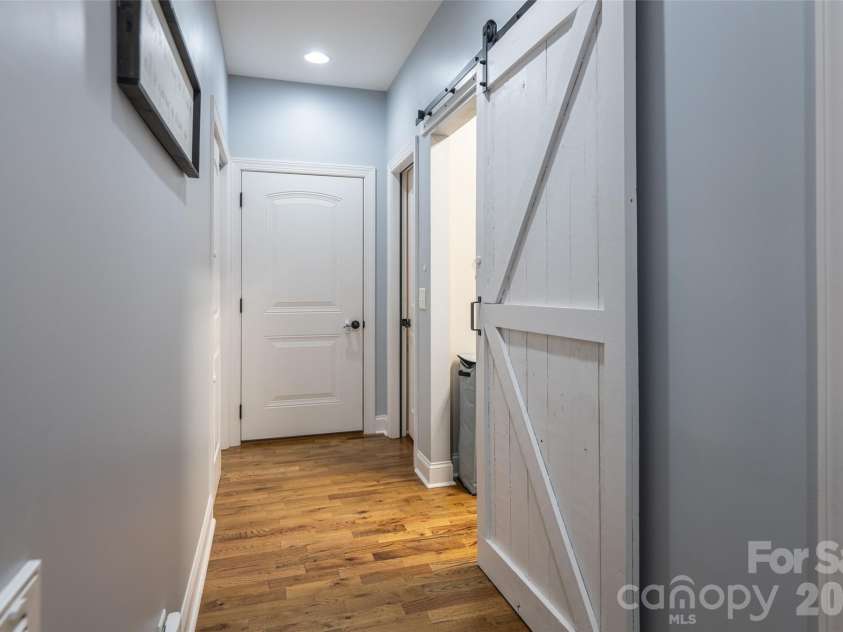 4398 Belmont Drive, Morganton, NC 28655.  MLS# CAR4402124, YatesRealty ID 43080. Hall to laundry, basement, and garage