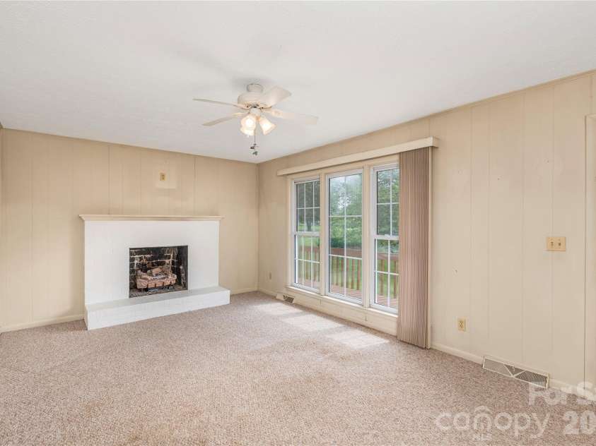 69 Emerald Lane, Hendersonville, NC 28792.  MLS# CAR4405038, YatesRealty ID 43085. Propane gas logs in Fireplace
