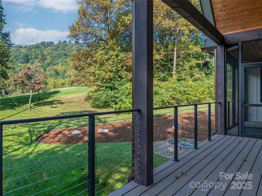 165 Robinhood Road, Asheville, NC 28804.  MLS# CAR4240751, YatesRealty ID 4309. Experience unforgettable outdoor living—spacious patios, a cozy screened porch with fireplace, sundeck, and a firepit for every season.