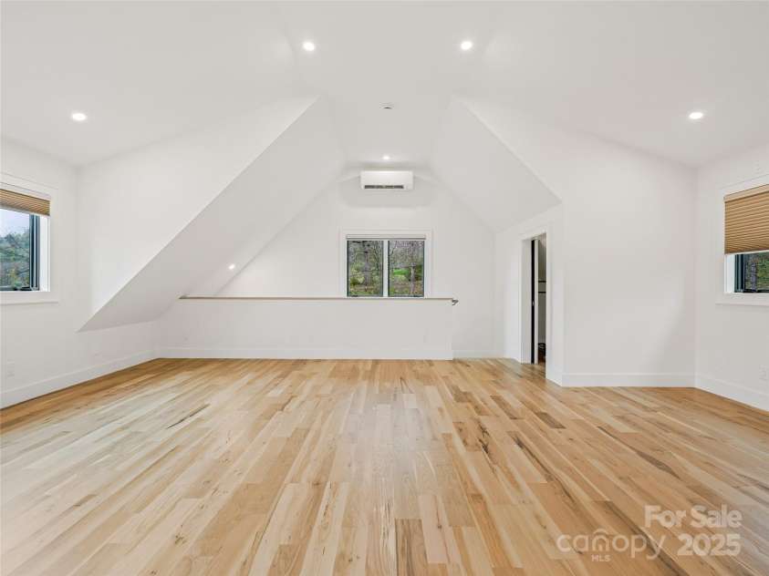 165 Robinhood Road, Asheville, NC 28804.  MLS# CAR4240751, YatesRealty ID 4309. Flexible bonus space above the garage—ideal as a bedroom suite, office, or media room, with projector wiring, wet bar plumbing, and abundant natural light