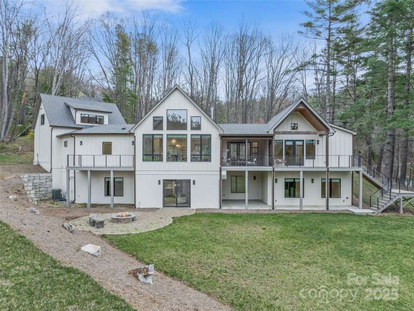 165 Robinhood Road, Asheville, NC 28804.  MLS# CAR4240751, YatesRealty ID 4309. Layered outdoor living with sweeping golf course and mountain views—designed to impress at every turn.