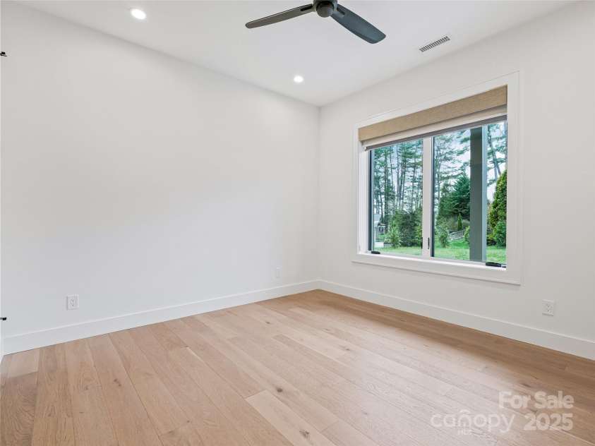 165 Robinhood Road, Asheville, NC 28804.  MLS# CAR4240751, YatesRealty ID 4309. Three lower-level bedrooms provide ample space for family, guests, or a dedicated home office.