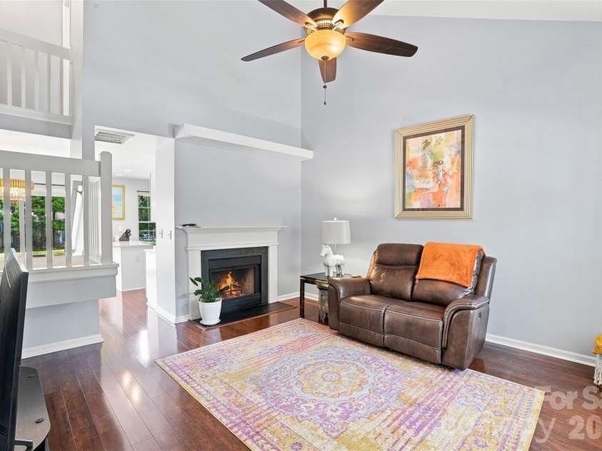 9014 Four Mile Creek Road, Charlotte, NC 28277.  MLS# CAR4410075, YatesRealty ID 43125. Living Room with Virtually enhanced fireplace.