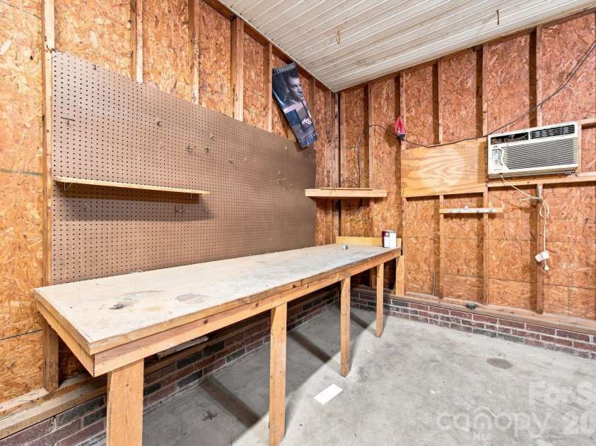 910 Little Brook Circle, York, SC 29745.  MLS# CAR4409495, YatesRealty ID 43130. Garage workshop area