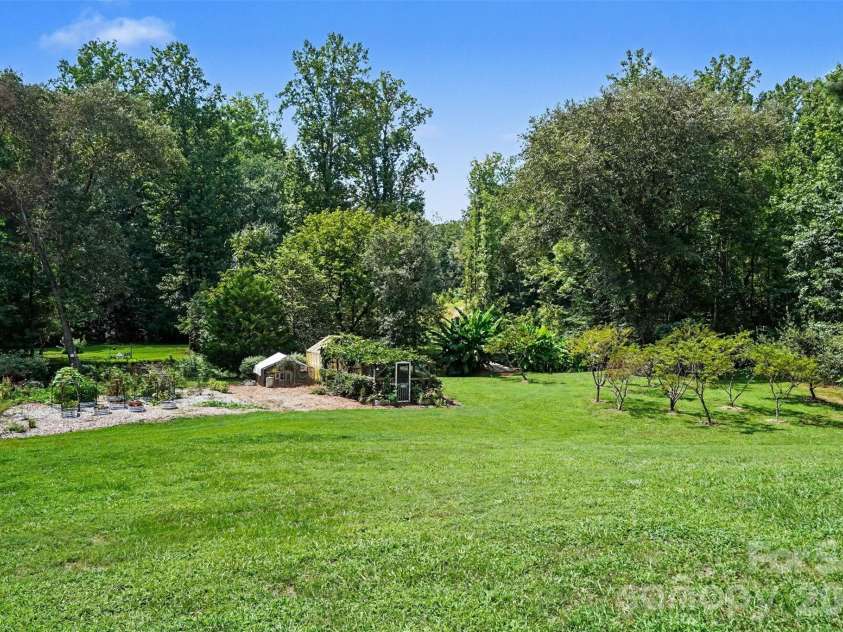 1206 Alberto Lane, Stanley, NC 28164.  MLS# CAR4411252, YatesRealty ID 43132. Orchard and greenhouse