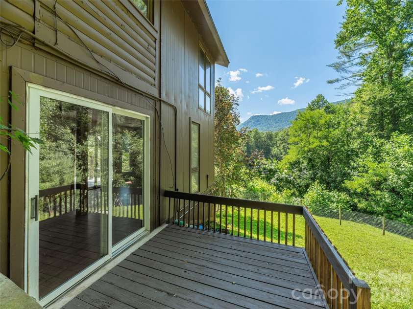 3543 Dark Ridge Road, Sylva, NC 28779.  MLS# CAR4410870, YatesRealty ID 43138. Back deck in fenced in yard