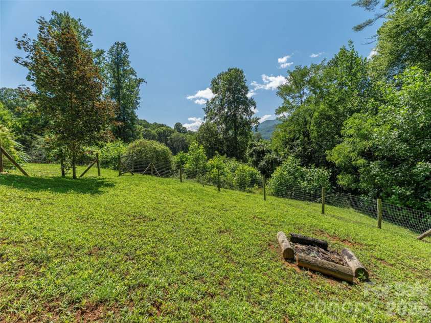 3543 Dark Ridge Road, Sylva, NC 28779.  MLS# CAR4410870, YatesRealty ID 43138. Side Yard View