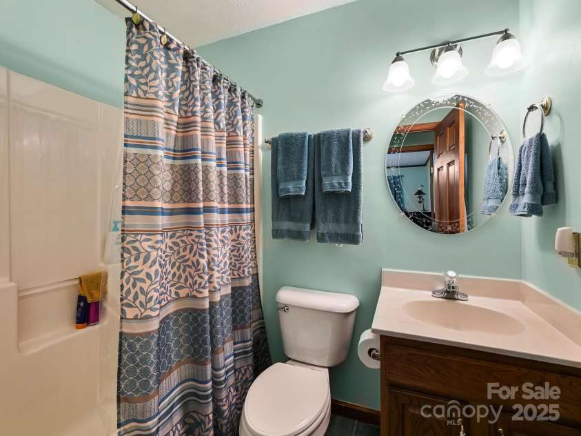 20 Brooks Cove Road, Candler, NC 28715.  MLS# CAR4255964, YatesRealty ID 4314. Guest bath