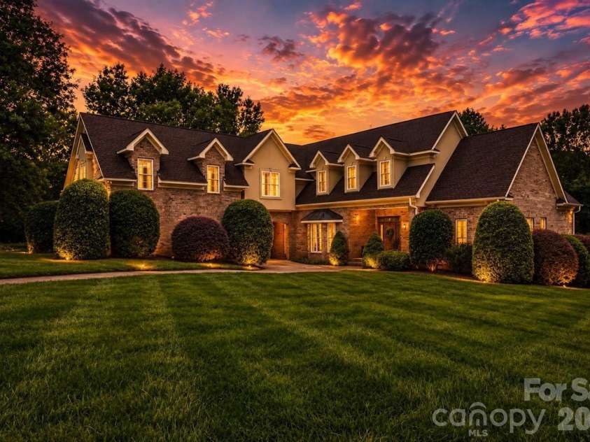 2027 Meadow Run Drive, Matthews, NC 28104.  MLS# CAR4410110, YatesRealty ID 43155. Twilight ShotPicture has been virtually edited for lighting