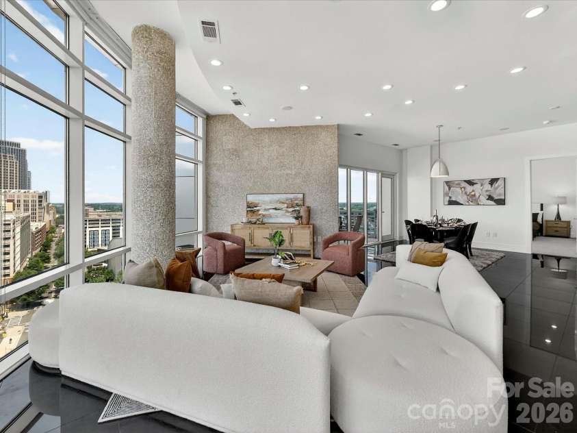 505 6th Street, Charlotte, NC 28202.  MLS# CAR4392815, YatesRealty ID 4316. Living area with floor to ceiling windows and skyline views