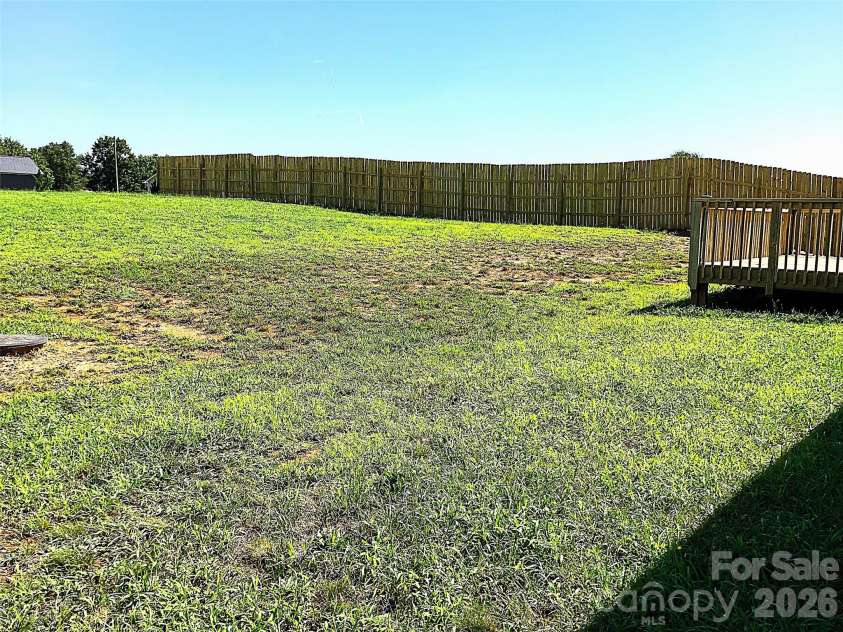109 Wheat Field Drive, Shelby, NC 28152.  MLS# CAR4413358, YatesRealty ID 43175. Spacious back yard view with side privacy fence