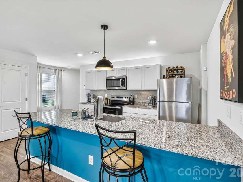 1942 Tranquility Circle, Newton, NC 28658.  MLS# CAR4413135, YatesRealty ID 43176. Focused Breakfast Bar/Spacious Granite View