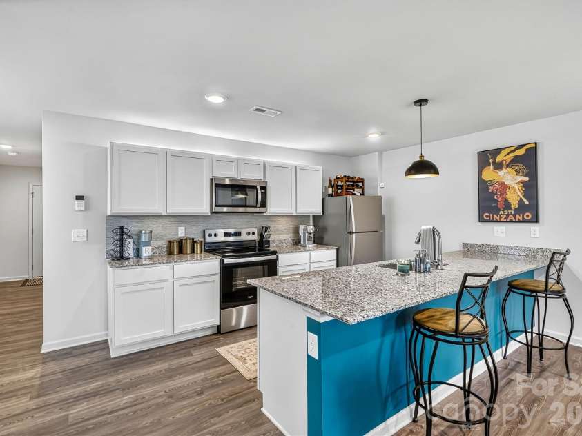 1942 Tranquility Circle, Newton, NC 28658.  MLS# CAR4413135, YatesRealty ID 43176. Focused Kitchen Bar View with Upgraded Pendant Lighting
