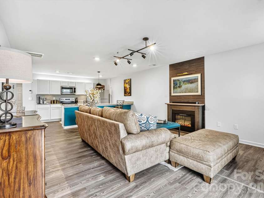 1942 Tranquility Circle, Newton, NC 28658.  MLS# CAR4413135, YatesRealty ID 43176. Focused Living Room View with Fireplace Accent Wall and Upgraded Lighting