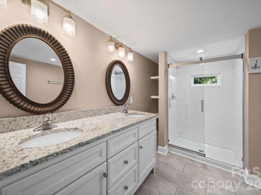703 Windsor Street, Monroe, NC 28112.  MLS# CAR4412570, YatesRealty ID 43195. Primary bathroom