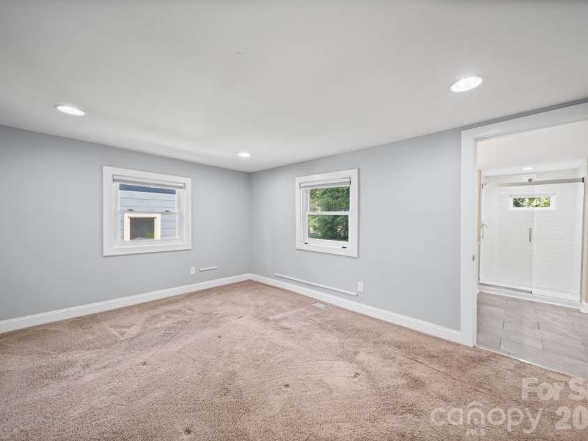 703 Windsor Street, Monroe, NC 28112.  MLS# CAR4412570, YatesRealty ID 43195. Primary bedroom