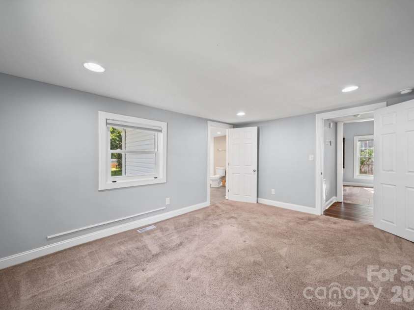 703 Windsor Street, Monroe, NC 28112.  MLS# CAR4412570, YatesRealty ID 43195. Primary bedroom