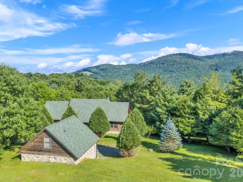525 Schoolhouse Ridge, Boone, NC 28607.  MLS# CAR4410636, YatesRealty ID 43202. Flat pastures and long-range, layered Blue Ridge Mountain Views!