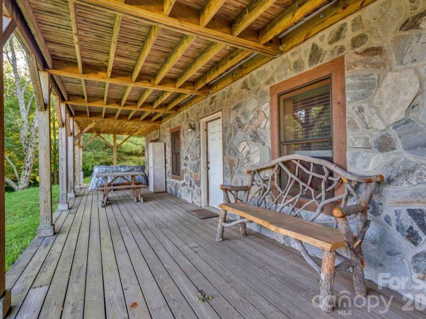 525 Schoolhouse Ridge, Boone, NC 28607.  MLS# CAR4410636, YatesRealty ID 43202. Lower-level deck with hot tub and VIEWS!