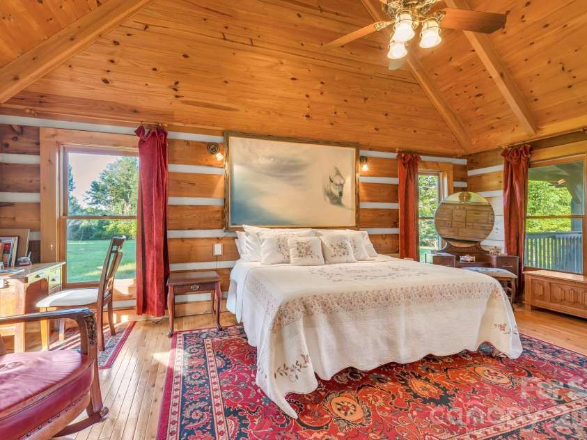 525 Schoolhouse Ridge, Boone, NC 28607.  MLS# CAR4410636, YatesRealty ID 43202. Main-level primary suite with cathedral ceiling & deck access