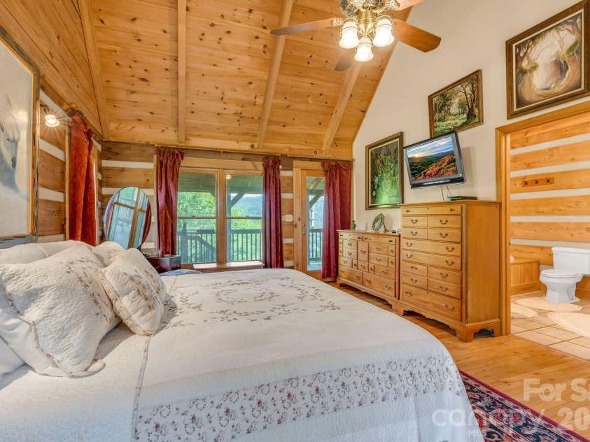 525 Schoolhouse Ridge, Boone, NC 28607.  MLS# CAR4410636, YatesRealty ID 43202. Main-level primary suite with cathedral ceiling & deck access
