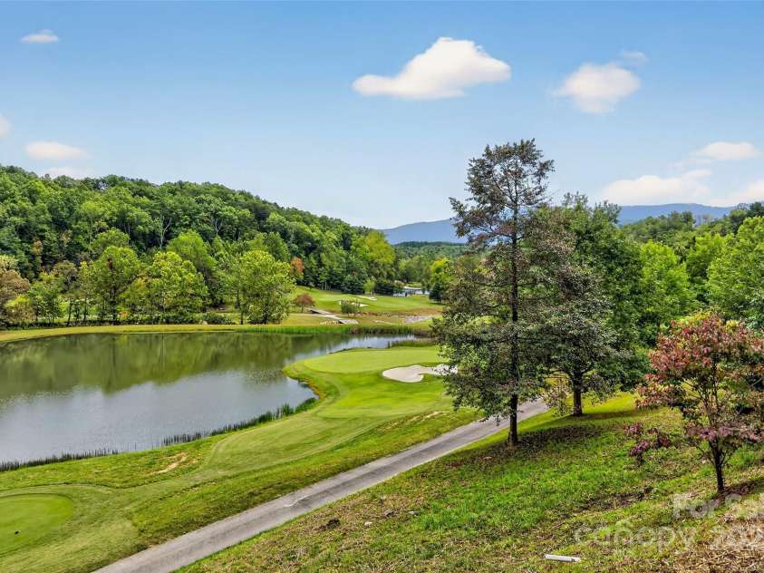 305 Clubhouse Lane, Mill Spring, NC 28756.  MLS# CAR4311469, YatesRealty ID 4321. Beautiful view of the mountains and water