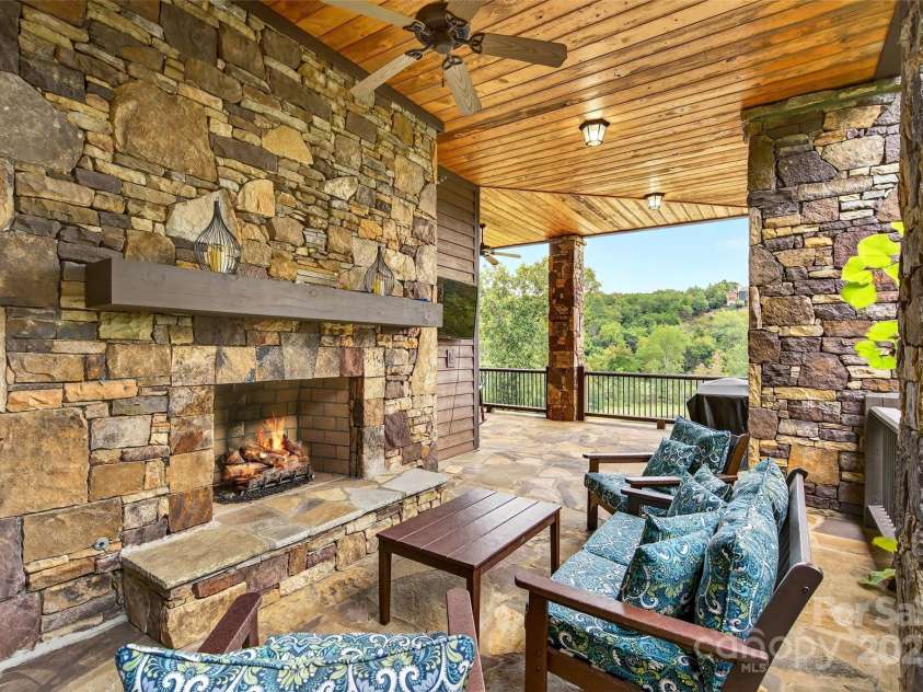 305 Clubhouse Lane, Mill Spring, NC 28756.  MLS# CAR4311469, YatesRealty ID 4321. Massive Stone fireplace