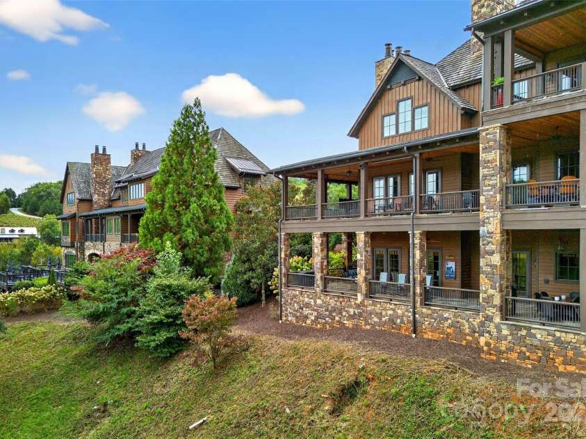 305 Clubhouse Lane, Mill Spring, NC 28756.  MLS# CAR4311469, YatesRealty ID 4321. Unit is lower level on the left