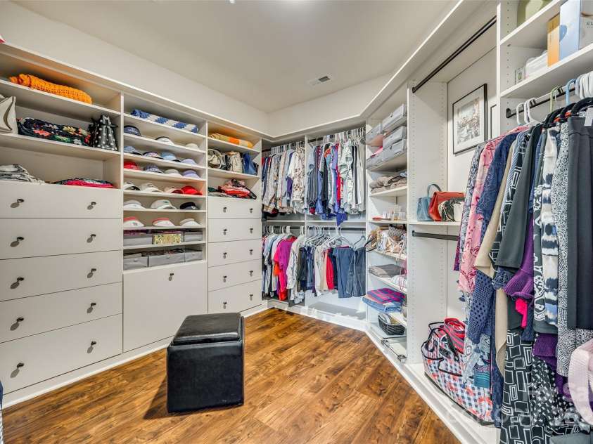 1035 Crescent Moon Drive, Fort Mill, SC 29715.  MLS# CAR4201241, YatesRealty ID 4323. Your dream custom built primary closet!