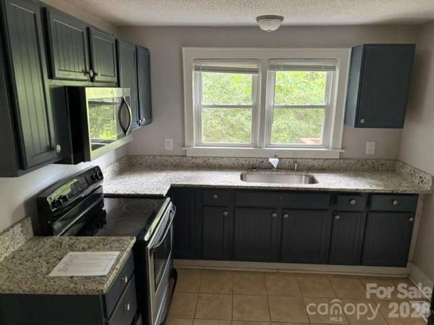 826 Davidson Avenue, Gastonia, NC 28052.  MLS# CAR4413623, YatesRealty ID 43240. Kitchen