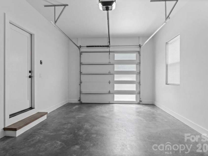 49 Timber Moss Drive, Asheville, NC 28804.  MLS# CAR4413689, YatesRealty ID 43247. Garage Main Level