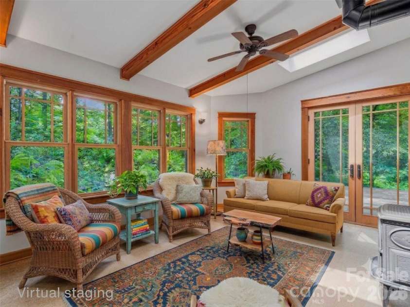 117 Woods View Trail, Fairview, NC 28730.  MLS# CAR4411756, YatesRealty ID 4326. Virtual staging in sunroom