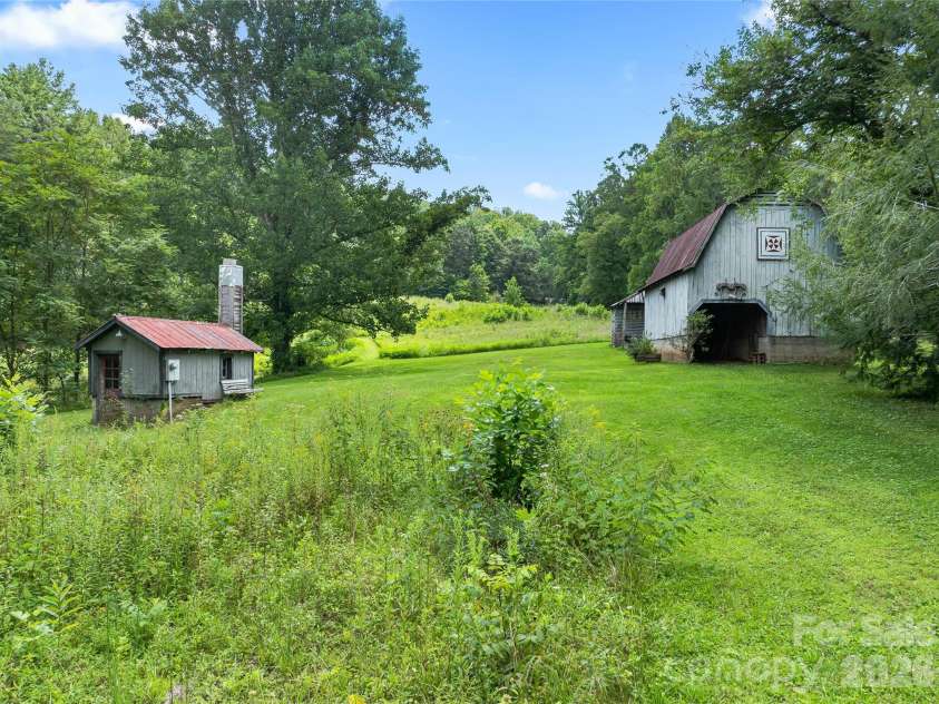 117 Woods View Trail, Fairview, NC 28730.  MLS# CAR4411756, YatesRealty ID 4326. Well house & lower barn