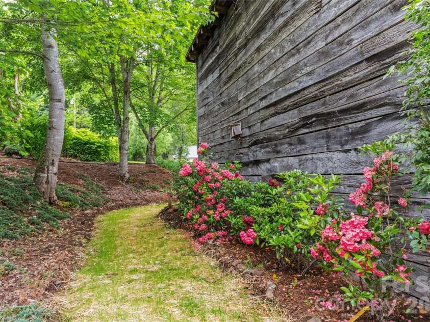 11820 State Highway 197 None, Burnsville, NC 28714.  MLS# CAR4361190, YatesRealty ID 43270. Pathway by barn