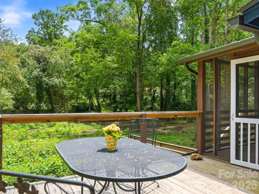 468 Governors View Road, Asheville, NC 28805.  MLS# CAR4409171, YatesRealty ID 43274. Back deck seating area.
