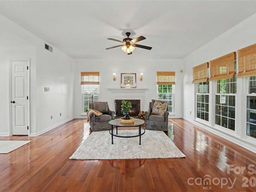 17205 Asti Court, Cornelius, NC 28031.  MLS# CAR4406087, YatesRealty ID 43276. Den with wood burning fireplace.