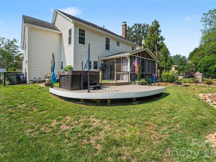 17205 Asti Court, Cornelius, NC 28031.  MLS# CAR4406087, YatesRealty ID 43276. Extended deck with hot tub.