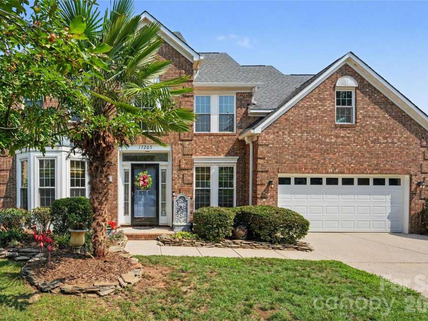 17205 Asti Court, Cornelius, NC 28031.  MLS# CAR4406087, YatesRealty ID 43276. Front with mature landscaping.